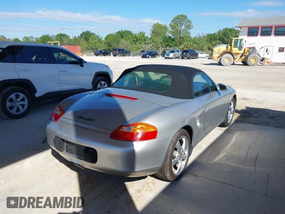 2002 Porsche Boxster z VIN WP0CA29882U622162, wystawiony jako IAAI lot #41654257 z przebiegiem 44 608 mil mil oraz . Historia ofert i sprzedaży dostępna na DreamBid. Obrazek 4.
