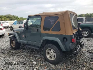 2002 Jeep Wrangler Sahara with VIN 1J4FA59S52P763290, listed as a Copart auction lot 59115665 with 129,479 mi miles and Non repairable. Bid and sale history available at DreamBid. Image 2.