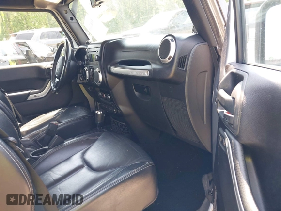 2013 Jeep Wrangler Unlimited Sahara with VIN 1C4BJWEG4DL666930, listed as a IAAI auction lot 42310569 with 206,577 mi miles and . Bid and sale history available at DreamBid. Image 5.