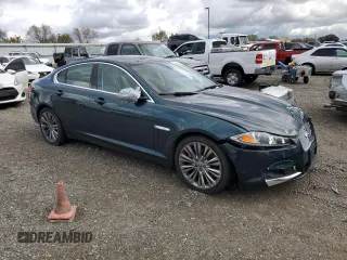 2012 Jaguar XF Portfolio with VIN SAJWA0HB4CLS49225, listed as a Copart auction lot 48070445 with 61,059 mi miles and Salvage Title. Bid and sale history available at carsss.com. Image 4.