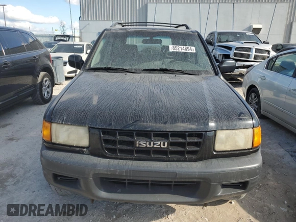 1999 Isuzu Rodeo S with VIN 4S2CK58W7X4357230, listed as a Copart auction lot 85214894 with 130,370 mi miles and Salvage title. Bid and sale history available at DreamBid. Image 5.