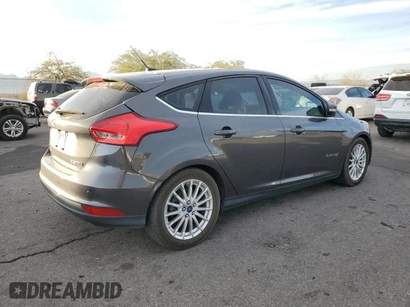 2015 Ford Focus Electric with VIN 1FADP3R40FL348785, listed as a Copart auction lot 84516374 with 85,633 mi miles and Salvage title. Bid and sale history available at DreamBid. Image 3.