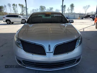 2014 Lincoln MKS z VIN 1LNHL9DK4EG600914, wystawiony jako Copart lot #47142225 z przebiegiem 183 024 mil mil oraz Czysty tytuł • Clean title. Historia ofert i sprzedaży dostępna na DreamBid. Obrazek 5.