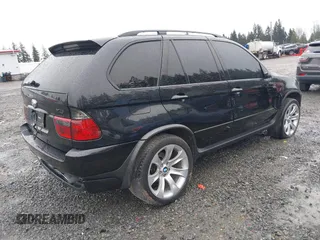 2005 BMW X5 4.8is with VIN 5UXFA93515LE82570, listed as a IAAI auction lot 41759657 with 212,687 mi miles. Bid and sale history available at carsss.com. Image 4.