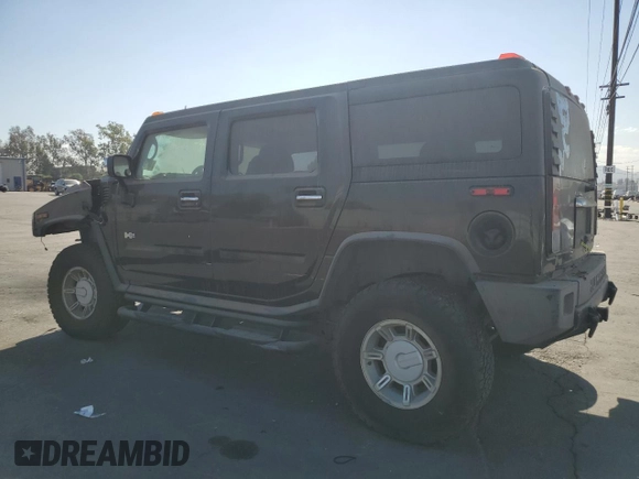 2004 Hummer H2 with VIN 5GRGN23U24H104327, listed as a Copart auction lot 74150914 with 181,933 mi miles and Salvage Title. Bid and sale history available at carsss.com. Image 2.