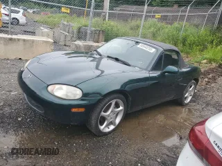 1999 Mazda MX-5 Miata z VIN JM1NB3535X0111819, wystawiony jako Copart lot #58940255 z przebiegiem 72 766 mil mil oraz Szkoda całkowita • Salvage title. Historia ofert i sprzedaży dostępna na DreamBid. Obrazek 1.