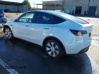 2022 Tesla Model Y Long Range with VIN 7SAYGDEE1NF402745, listed as a IAAI auction lot 41493850 with 11,222 mi miles and . Bid and sale history available at DreamBid. Image 3.