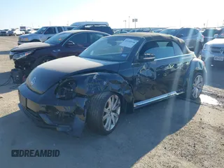 2014 Volkswagen Beetle 1.8T with VIN 3VW517AT4EM815243, listed as a IAAI auction lot 41245346 with 119,259 mi miles and . Bid and sale history available at DreamBid. Image 17.