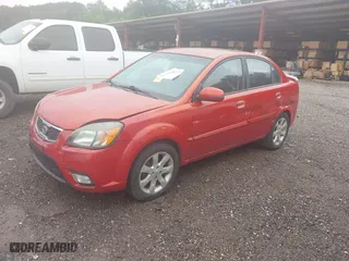 2011 Kia Rio LX with VIN KNADH4A33B6714471, listed as a IAAI auction lot 41970737 with 188,214 mi miles. Bid and sale history available at carsss.com. Image 2.