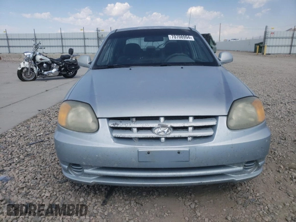 2005 Hyundai Accent GLS with VIN KMHCG35C55U341192, listed as a Copart auction lot 70708994 with 174,872 mi miles and Salvage Title. Bid and sale history available at carsss.com. Image 5.
