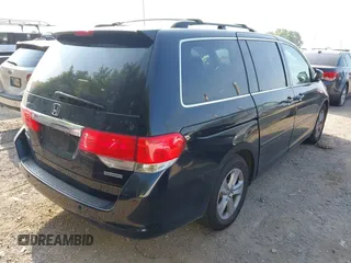 2010 Honda Odyssey Touring with VIN 5FNRL3H96AB031016, listed as a IAAI auction lot 42828397 with 261,881 mi miles and . Bid and sale history available at DreamBid. Image 4.