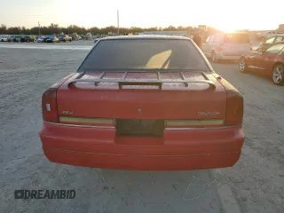 1989 Oldsmobile Cutlass z VIN 1G3WH14W0KD355432, wystawiony jako Copart lot #78787204 z przebiegiem Nie podano mil oraz Szkody całkowita. Historia ofert i sprzedaży dostępna na DreamBid. Obrazek 6.