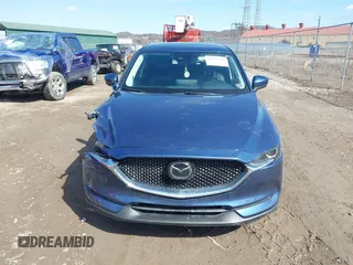 2021 Mazda CX-5 Touring with VIN JM3KFBCM4M0404093, listed as a IAAI auction lot 41751343 with 50,536 mi miles. Bid and sale history available at carsss.com. Image 12.