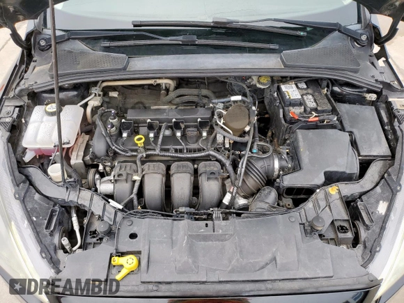2015 Ford Focus SE z VIN 1FADP3F29FL357021, wystawiony jako Copart lot #57985125 z przebiegiem 142 786 mil mil oraz Szkoda całkowita • Salvage title. Historia ofert i sprzedaży dostępna na DreamBid. Obrazek 11.