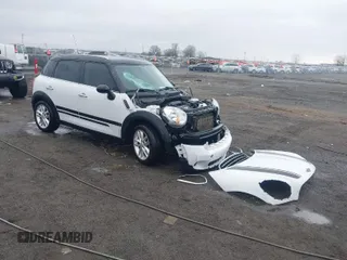 2014 MINI Countryman with VIN WMWZB3C55EWM32661, listed as a IAAI auction lot 41490239 with 93,109 mi miles and . Bid and sale history available at DreamBid. Image 1.