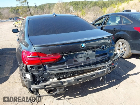 2017 BMW 7 Series 740i z VIN WBA7E2C57HG739465, wystawiony jako IAAI lot #41764778 z przebiegiem 84 814 mil mil oraz . Historia ofert i sprzedaży dostępna na DreamBid. Obrazek 6.