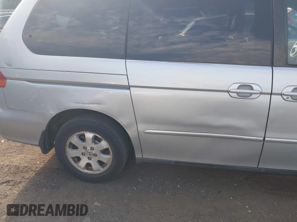 2003 Honda Odyssey EX-L with VIN 5FNRL18913B061340, listed as a IAAI auction lot 42633790 with 1,281,195 mi miles and . Bid and sale history available at DreamBid. Image 16.