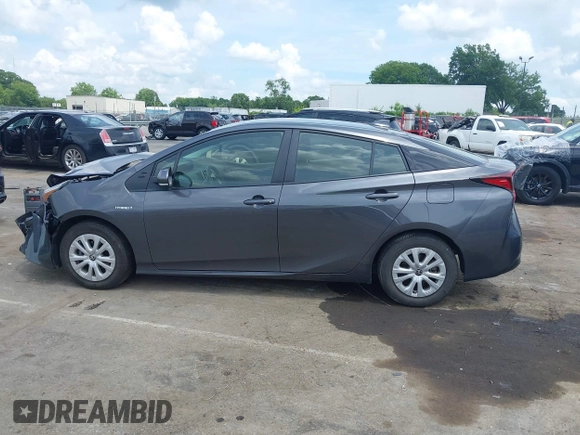 2021 Toyota Prius L Eco z VIN JTDKAMFU3M3152785, wystawiony jako IAAI lot #42501351 z przebiegiem 60 489 mil mil oraz . Historia ofert i sprzedaży dostępna na DreamBid. Obrazek 14.