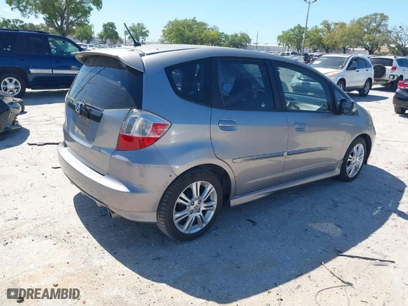 2009 Honda Fit Sport w/Navi with VIN JHMGE886X9S055014, listed as a IAAI auction lot 41847661 with 54,234 mi miles. Bid and sale history available at carsss.com. Image 4.