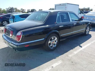 2001 Bentley Arnage with VIN SCBLC31E11CX06297, listed as a IAAI auction lot 41980275 with 63,510 mi miles and . Bid and sale history available at DreamBid. Image 4.