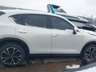 2023 Mazda CX-5 2.5 S Premium Package with VIN JM3KFBDM9P0124382, listed as a IAAI auction lot 40908008 with 25,148 mi miles. Bid and sale history available at carsss.com. Image 13.