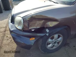 2005 Hyundai Santa Fe GLS z VIN KM8SC13D45U929446, wystawiony jako IAAI lot #41200311 z przebiegiem 157 669 mil mil oraz . Historia ofert i sprzedaży dostępna na DreamBid. Obrazek 6.