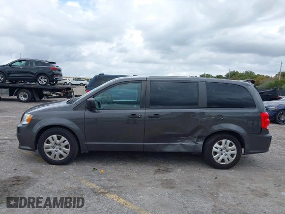 2019 Dodge Grand Caravan SE with VIN 2C4RDGBGXKR796974, listed as a IAAI auction lot 42008704 with 129,229 mi miles and . Bid and sale history available at DreamBid. Image 14.
