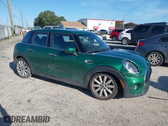 2020 MINI Hardtop 4 Door Cooper with VIN WMWXU7C06L2M63032, listed as a IAAI auction lot 42572567 with 86,220 mi miles and . Bid and sale history available at DreamBid. Image 1.