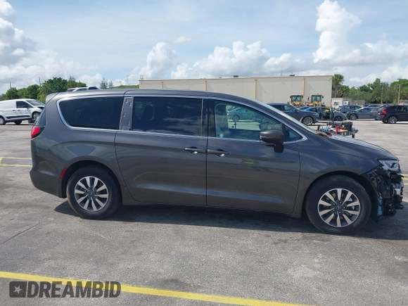 2023 Chrysler Pacifica Hybrid Touring L with VIN 2C4RC1L74PR579782, listed as a IAAI auction lot 42487390 with Not provided miles and . Bid and sale history available at DreamBid. Image 14.