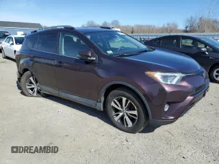 2018 Toyota RAV4 XLE with VIN 2T3RFREVXJW851654, listed as a Copart auction lot 48961055 with 166,664 mi miles and Salvage Title. Bid and sale history available at DreamBid. Image 4.