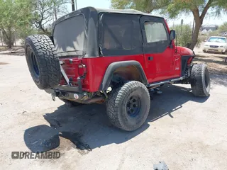 2000 Jeep Wrangler Sport with VIN 1J4FA49S0YP731544, listed as a IAAI auction lot 42570831 with Not provided miles and . Bid and sale history available at DreamBid. Image 4.