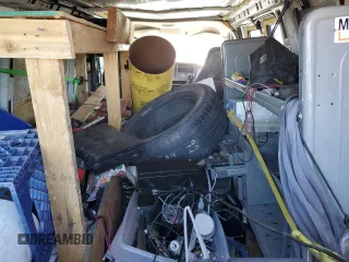 2005 Chevrolet Express Cargo z VIN 1GCFG15X751112877, wystawiony jako Copart lot #77494014 z przebiegiem 349 555 mil mil oraz Czysty tytuł • Clean title. Historia ofert i sprzedaży dostępna na DreamBid. Obrazek 11.