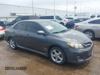2011 Toyota Corolla L with VIN 2T1BU4EE6BC679516, listed as a IAAI auction lot 42104879 with 184,014 mi miles. Bid and sale history available at carsss.com. Image 1.
