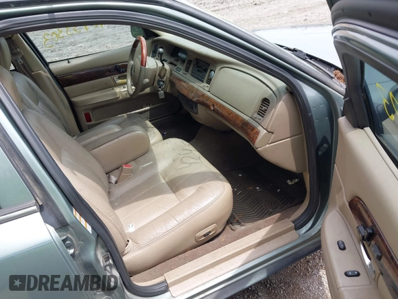 2005 Mercury Grand Marquis LS Premium z VIN 2MHHM75W95X607697, wystawiony jako IAAI lot #42453303 z przebiegiem 142 879 mil mil oraz . Historia ofert i sprzedaży dostępna na DreamBid. Obrazek 5.