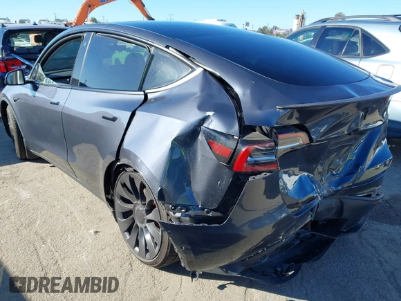 2022 Tesla Model Y Performance with VIN 7SAYGDEF7NF562895, listed as a IAAI auction lot 41692864 with 29,904 mi miles and . Bid and sale history available at DreamBid. Image 3.