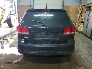 2013 Dodge Journey Crew with VIN 3C4PDCCG4DT693869, listed as a Copart auction lot 63666684 with 134,424 mi miles and Salvage title. Bid and sale history available at DreamBid. Image 6.