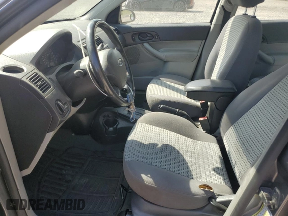 2007 Ford Focus S z VIN 1FAHP34N57W145697, wystawiony jako Copart lot #55335235 z przebiegiem 228 416 mil mil oraz Nie do naprawy • Non repairable. Historia ofert i sprzedaży dostępna na DreamBid. Obrazek 7.