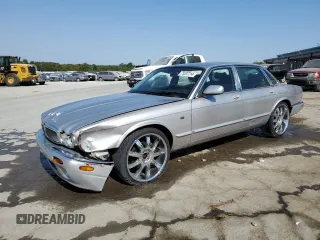 2000 Jaguar XJ with VIN SAJDA14C9YLF17465, listed as a Copart auction lot 75537214 with 115,918 mi miles and Salvage Title. Bid and sale history available at DreamBid. Image 1.