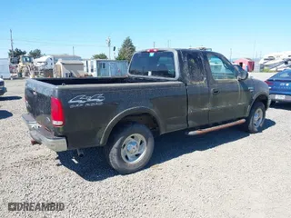 2000 Ford F-150 XL with VIN 1FTRX18L6YKB06492, listed as a IAAI auction lot 42058110 with 169,217 mi miles. Bid and sale history available at carsss.com. Image 4.