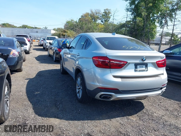 2018 BMW X6 xDrive35i z VIN 5UXKU2C51J0X50507, wystawiony jako IAAI lot #40275236 z przebiegiem 67 523 mil mil oraz . Historia ofert i sprzedaży dostępna na DreamBid. Obrazek 3.