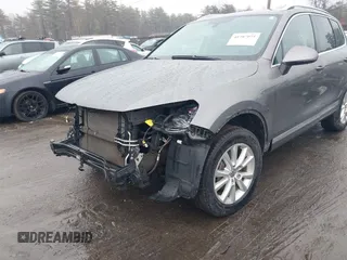 2013 Volkswagen Touareg Lux with VIN WVGEF9BP7DD007170, listed as a IAAI auction lot 41787075 with 131,089 mi miles and . Bid and sale history available at DreamBid. Image 6.