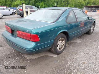 1996 Ford Thunderbird LX z VIN 1FALP62W9TH118637, wystawiony jako IAAI lot #42311641 z przebiegiem 96 361 mil mil oraz . Historia ofert i sprzedaży dostępna na DreamBid. Obrazek 4.