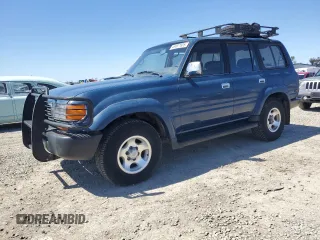 1995 Toyota Land Cruiser z VIN JT3DJ81W7S0110714, wystawiony jako Copart lot #49997605 z przebiegiem 299 884 mil mil oraz Czysty tytuł • Clean title. Historia ofert i sprzedaży dostępna na DreamBid. Obrazek 1.