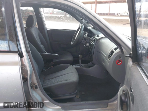 2003 Hyundai Accent GL with VIN KMHCG45C93U476176, listed as a IAAI auction lot 41940608 with 212,264 mi miles. Bid and sale history available at carsss.com. Image 5.