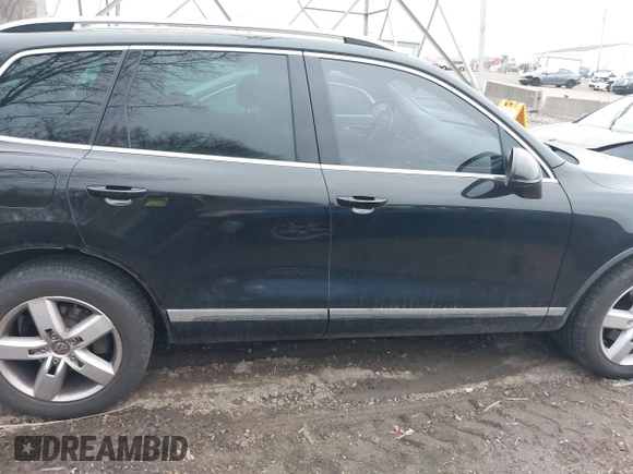 2012 Volkswagen Touareg Sport with VIN WVGFK9BP7CD002243, listed as a IAAI auction lot 41863765 with 136,231 mi miles and . Bid and sale history available at DreamBid. Image 13.