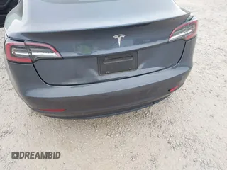 2023 Tesla Model 3 with VIN 5YJ3E1EA5PF474382, listed as a IAAI auction lot 41764268 with 31,040 mi miles and . Bid and sale history available at DreamBid. Image 6.