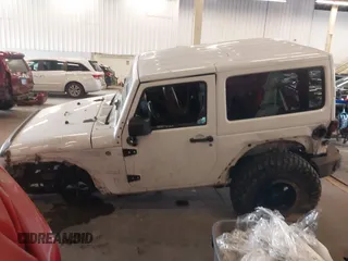 2012 Jeep Wrangler Arctic z VIN 1C4AJWBG9CL233232, wystawiony jako IAAI lot #42282805 z przebiegiem 109 927 mil mil oraz . Historia ofert i sprzedaży dostępna na DreamBid. Obrazek 14.