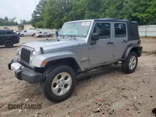 2014 Jeep Wrangler Unlimited Sahara with VIN 1C4BJWEG9EL142528, listed as a Copart auction lot 63685315 with 125,248 mi miles and Salvage title. Bid and sale history available at DreamBid. Image 1.