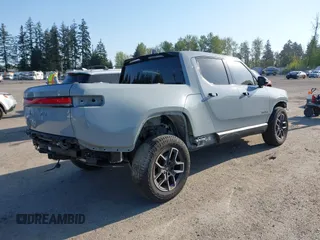 2022 Rivian R1T Adventure z VIN 7FCTGAAA5NN007018, wystawiony jako IAAI lot #42018939 z przebiegiem 41 991 mil mil oraz . Historia ofert i sprzedaży dostępna na DreamBid. Obrazek 4.