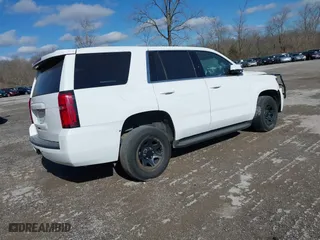 2020 Chevrolet Tahoe Commercial with VIN 1GNSKDEC2LR217697, listed as a IAAI auction lot 40815499 with 128,503 mi miles. Bid and sale history available at carsss.com. Image 4.